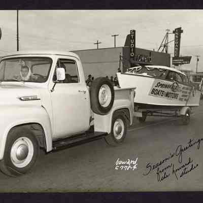 Photograph, Christmas parade in front of Howard Studios, Springfield, Oregon, Date unknown.