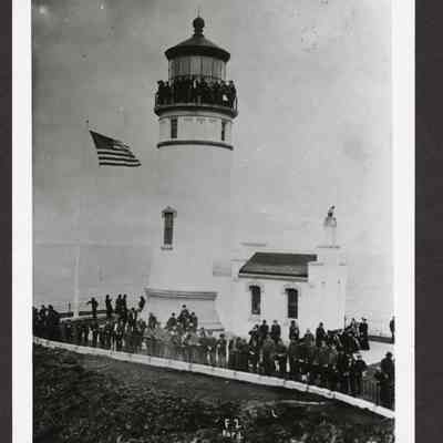Photograph of crowd in and around light house