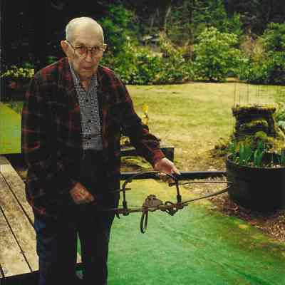 James R. Drury, holding bear trap