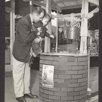 Photograph, Donation to March of Dimes, date and location unknown.