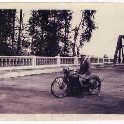 Photograph of Bill Davis on his motorcycle, first ride over a new bridge, Springfield, 1926