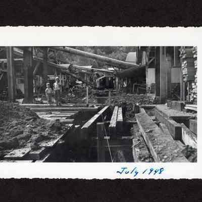 Photograph of two unknown young boys near the construction of 24" drain at Booth Kelly Lumber Mill, Springfield, Oregon, 1948