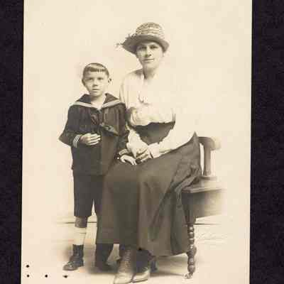 Photograph on postcard of women and boy, Lillie and Jamie