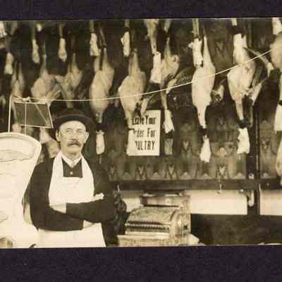 Photograph of Post Card of a Meat Market at 3rd and Main St. J.E. Swarts. Date unknown.