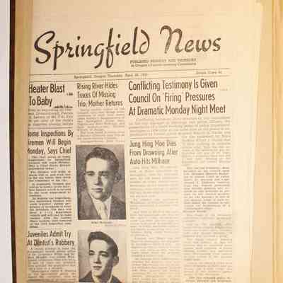 Loose newspaper material inside first page of scrapbook