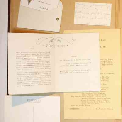 Loose materials inside first page of scrapbook