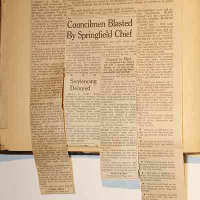 Page 12, unfolded newspaper clippings