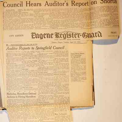 Page 15, unfolded newspaper clippings