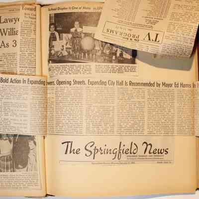 Page 31, unfolded newspaper clippings