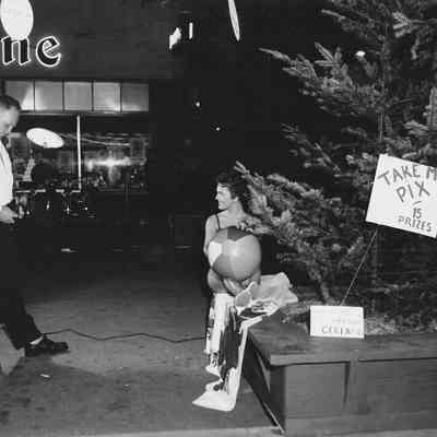 Photograph of female model and photographer for Take My Pic, Shoppers Paradise, Springfield, Oregon, 1957.