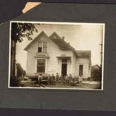 Photograph, House moving, date and location unknown.