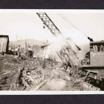 Photograph of the Robertson's house moving locations, at Booth-Kelly Camp 5, Wendling, Oregon, 1935