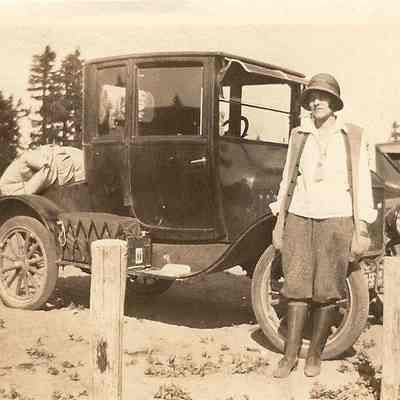 Photograph of unknown women in front of Model T Ford car