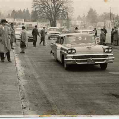 Photograph of cars and pedestrians crossing new Springfield bridge from Glenwood, Oregon, date unknown.