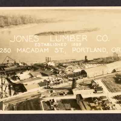 Photograph on postcard of ariel view of Jones Lumber Company next to the Willamette River, date unknown