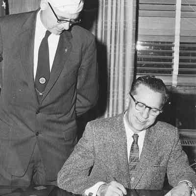 Photograph of American Legion men at signing ceremony, date unknown