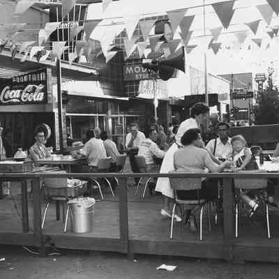 Photograph of street cafe on Main Street at Shoppers Paradise event, Springfield, Oregon, 1957