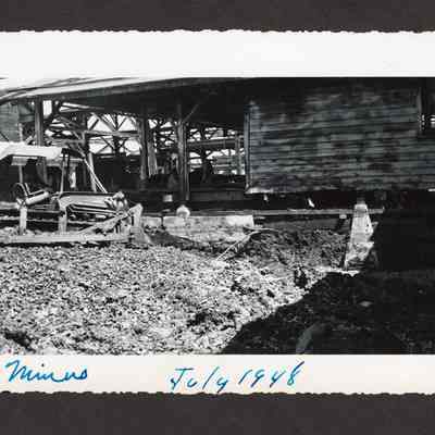 Photograph of the filling of the old log pond at Booth-Kelly Lumber Mill