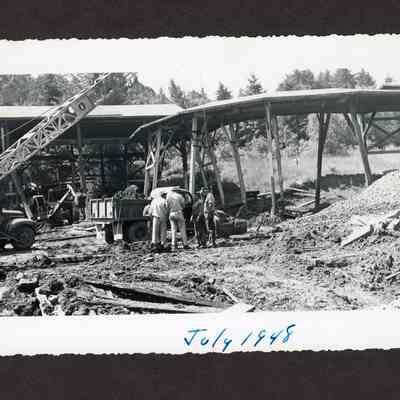 Photograph of the draining and filling of the old log pond at the Booth-Kelly Lumber Mill