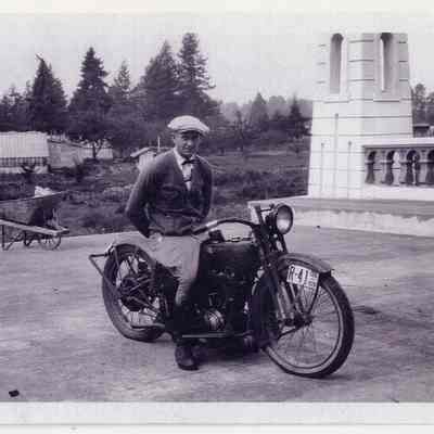 Photograph of Bill Davis on his motorcycle, bridge in Springfield, 1926