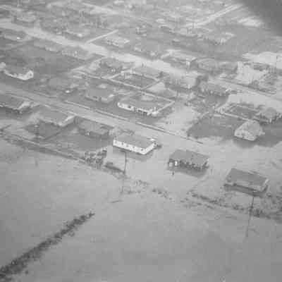 Photograph of aerial view of flooded residential area, date unknown.
