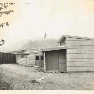Photograph of a school building, 1940s
