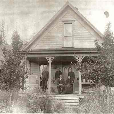 Photograph of the Warner family in front of their house, Warner Homestead, Fall Creek, Oregon