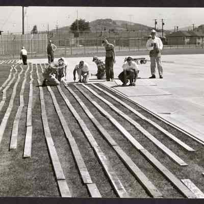 Photograph, Men Installing Wooden Floor, Undated