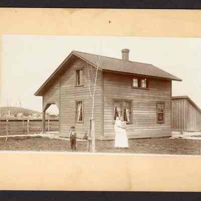 Photograph, Two story wooden house, date and location unknown.