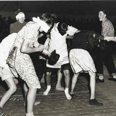 Photograph of boys dressed as girls blindfolded for Springfield High School class of 1953 Initiation, Springfield, Oregon, circa 1948-1953