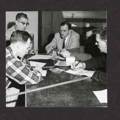 Photograph, Men in a Meeting, Undated