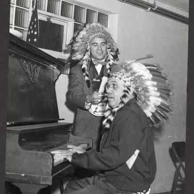 Photograph, Two whitemen wearing Native American Headdresses, Springfield, Oregon, 1958
