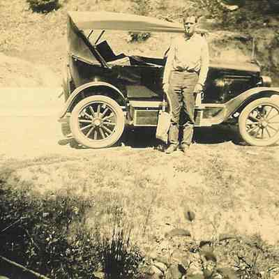 Unidentified man with car.