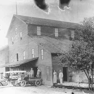 Photograph of Sprfld. Mill with Trucks & People
