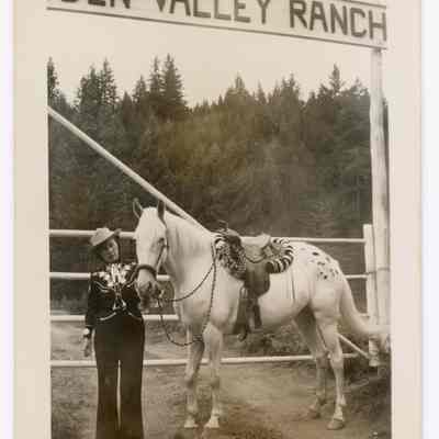 Photograph of Etta Davis and ranch sign, Hidden Valley Ranch, Oregon, undated