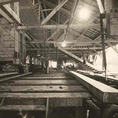 Photograph of the interior of the old saw mill at Fischer Company, Marcola, Oregon, circa 1948
