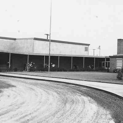 Photograph of bus in front of Moffitt Elementary School, Springfield, Oregon, 1955