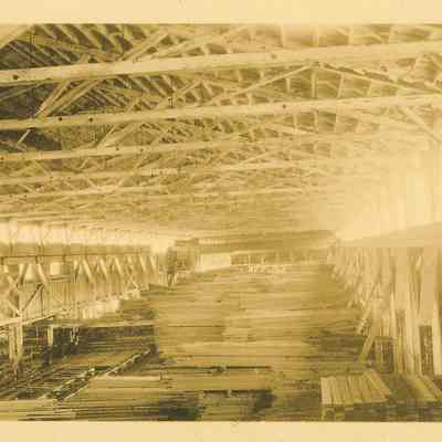 Photograph of monorail and lumber in the sorting shed at Wendling, Oregon
