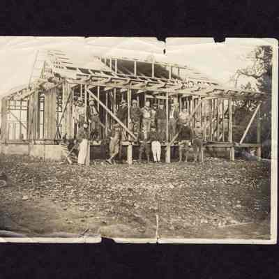 Photograph of 15 Men in front of Barn Under Construction, Undated