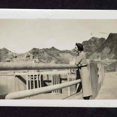 Photograph of a woman overlooking Hoover Dam, circa 1940