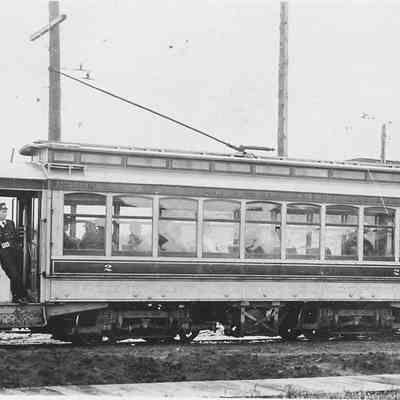 Photograph of Street car with Conductor and Passengers