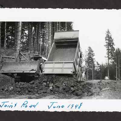 Photograph of a truck and tractor on Joint Road