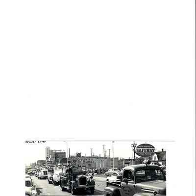 Photograph of a parade of fire trucks on Main St., Springfield, Oregon