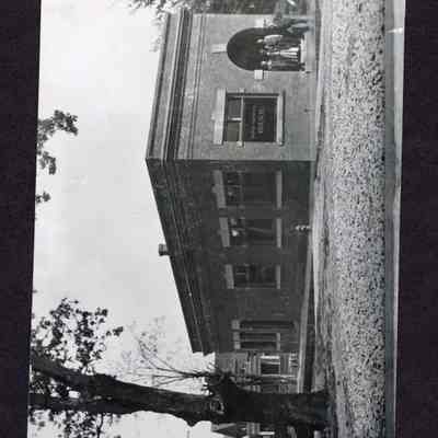 Photograph of the "First National Bank". Located at Second and Main St. Springfield, Oregon. The building is still standing and used as a dry cleaning establishment. Date unknown.