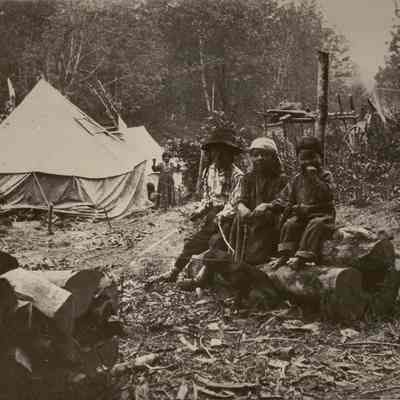 Photograph of 3 Native American Boys sitting on Log, Undated