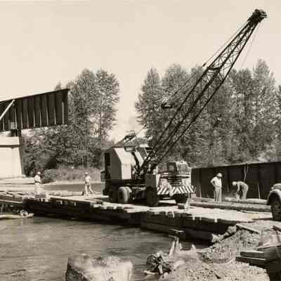 Photograph of crane working on Springfield bridge, Springfield, Oregon, date unknown.