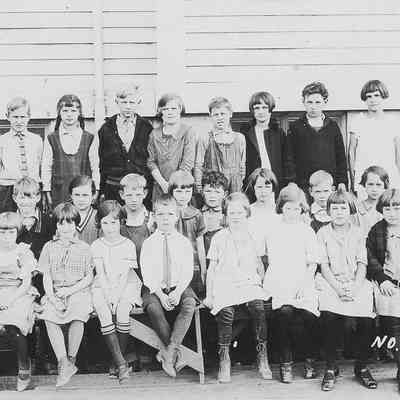 Photograph of elementary students with teacher Miss Voris, Springfield, Oregon, date unknown.