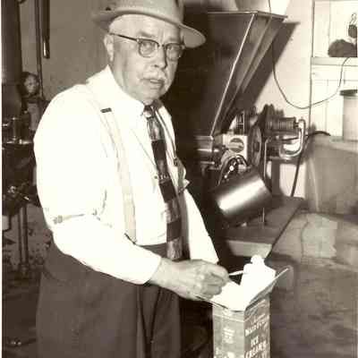 Photograph of Mr. Christainsen at Springfield Creamery, Springfield Oregon