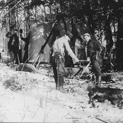 Photograph of four men hunting