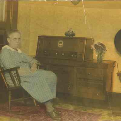 Jane Mountjoy sitting by Radio.